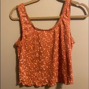 orange with little flowers and lace lining crop top